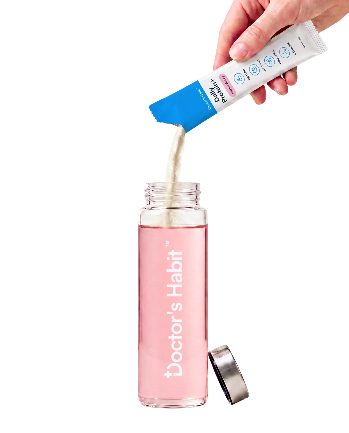A hand tipping a Daily Protein+ sachet so the powder pours into a clear glass bottle