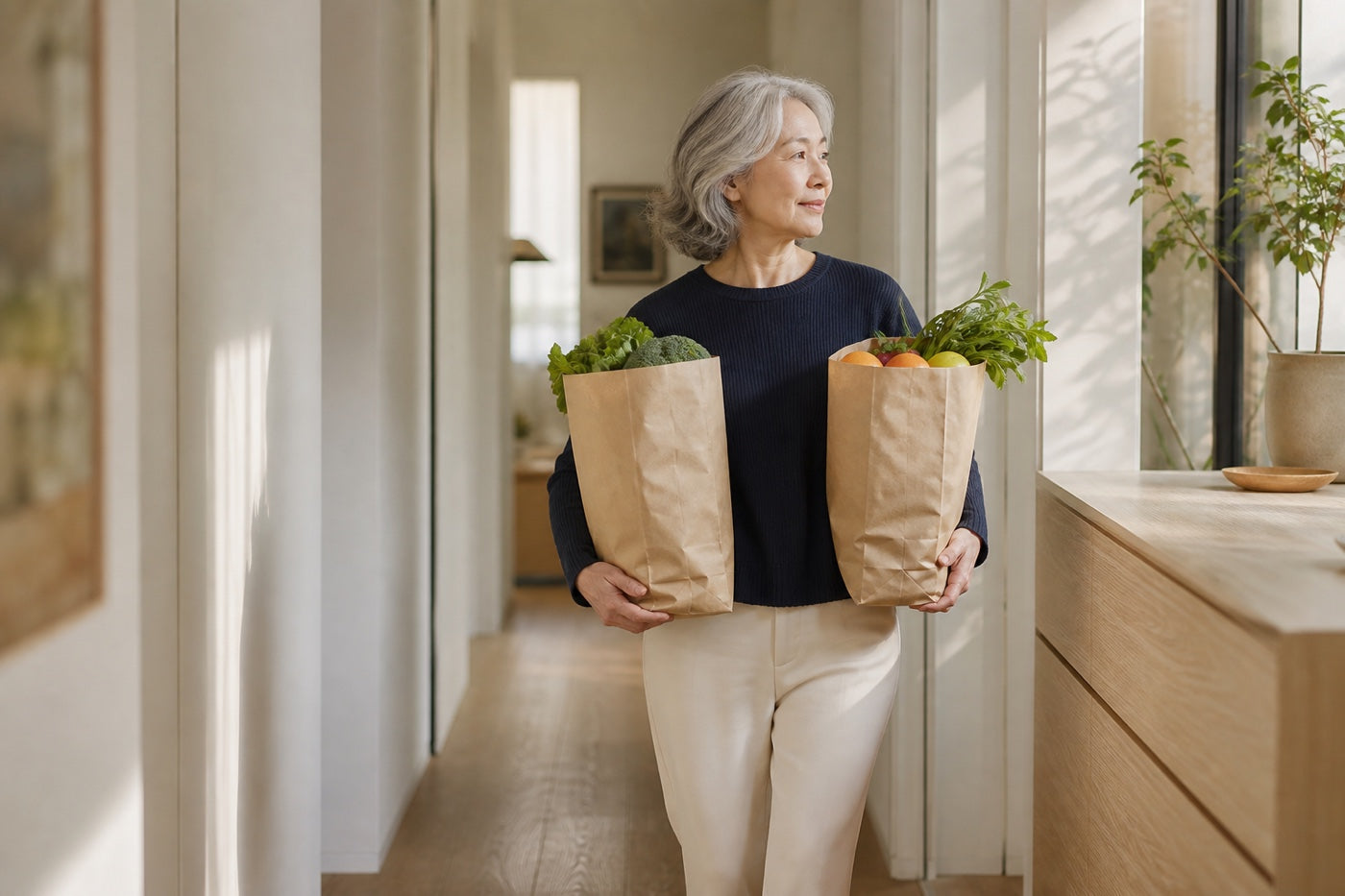 A woman carrying groceries upstairs with ease
